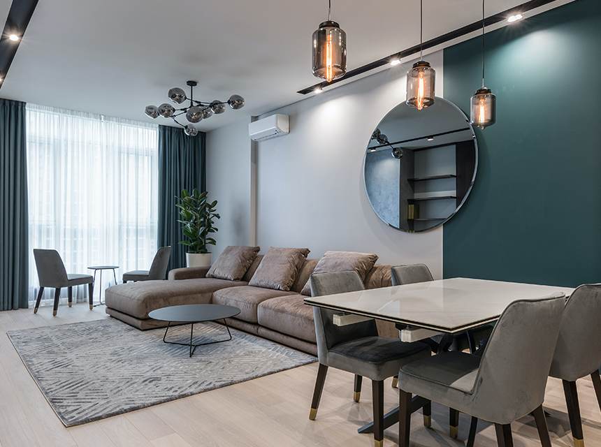 A living room with a table and chairs